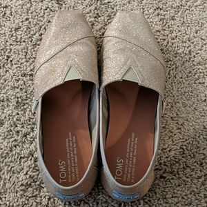 Toms gold sparkly slip ons